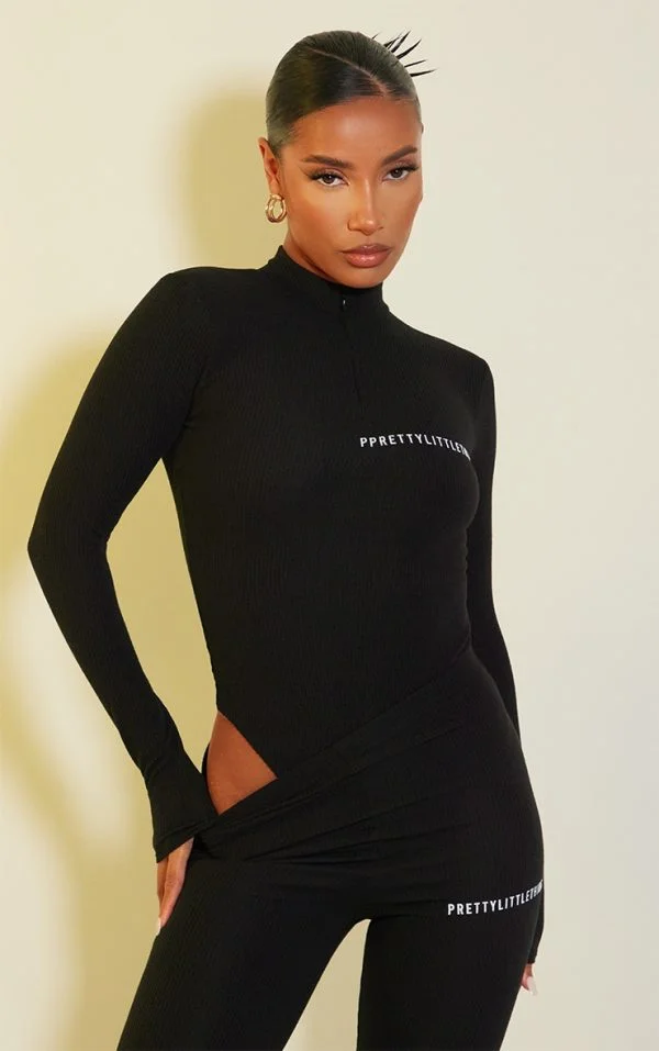 PRETTYLITTLETHING Black Crinkle Rib Half Zip Bodysuit