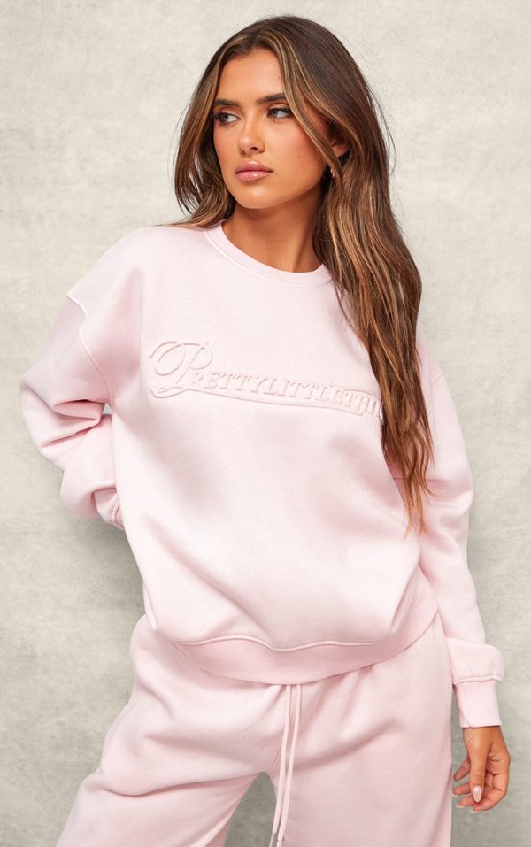PRETTYLITTLETHING Baby Pink Embossed Graphic Oversized Sweatshirt