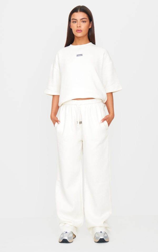 PRETTYLITTLETHING Cream Badge Detail Mid Rise Wide Leg Sweatpants