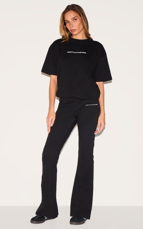 PRETTYLITTLETHING Black Printed Flared Pants