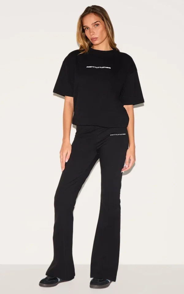 PRETTYLITTLETHING Black Printed Flared Pants