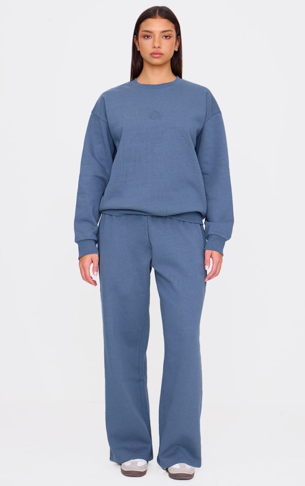PRETTYLITTLETHING Washed Blue Premium Embossed Wide Leg Sweatpants