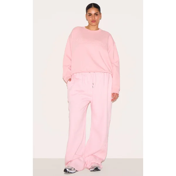 PRETTYLITTLETHING Plus Baby Pink Embossed Graphic Straight Leg Sweatpants